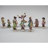 A set of nine Dresden porcelain 'Monkey Band' figures, largest 17cm high; together with another