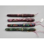 Four Conway Stewart 'Dinkie' fountain pens, 536, 540, 550, 560, each with 14ct gold nib.