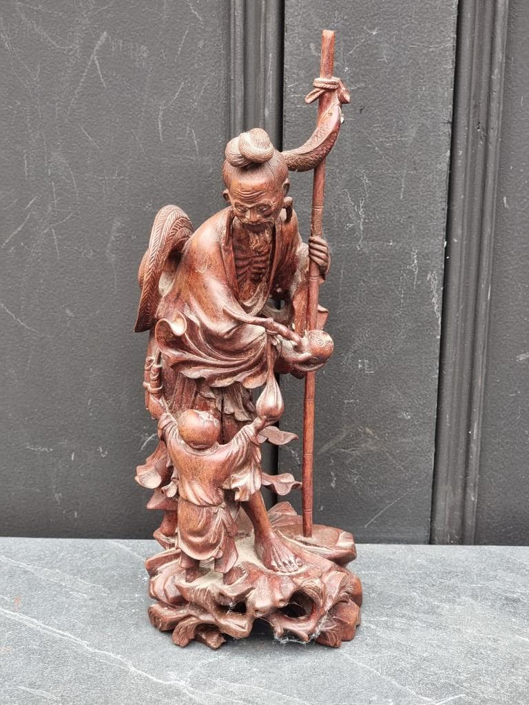 A Japanese carved wood fisherman, 32cm high; together with a Thai carved rosewood maiden, 31.5cm - Image 3 of 3