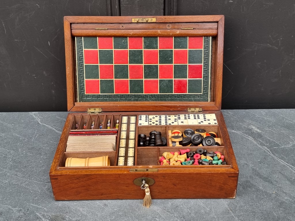 A Victorian mahogany games compendium, with fitted interior, 33.5cm wide.