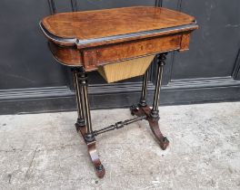 A Victorian burr walnut, ebonized and inlaid work table, indistinctly stamped 'Lamb, Manchester',