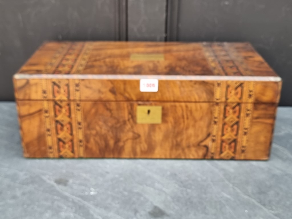 A Victorian figured walnut and parquetry writing slope, 50cm wide.