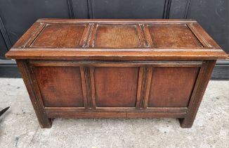 A small reproduction oak panelled coffer, 91.5cm wide.