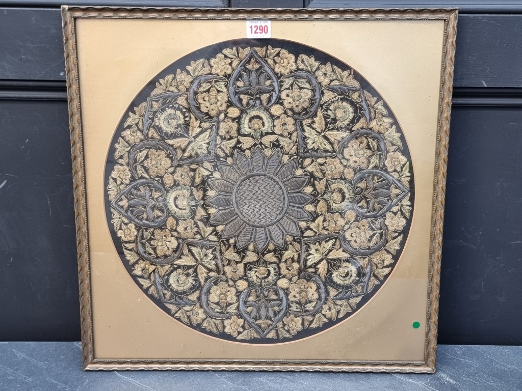 An Eastern silk embroidered circular panel, 42cm diameter.