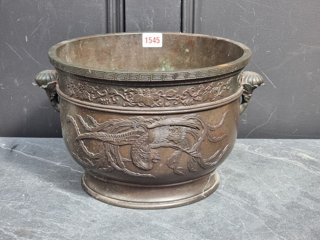 A large Japanese bronze twin handled censor, 20cm high x 28.5cm diameter.