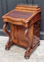 A Victorian walnut Davenport, 54.5cm wide.