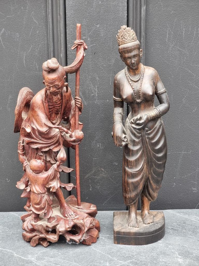 A Japanese carved wood fisherman, 32cm high; together with a Thai carved rosewood maiden, 31.5cm