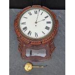 An early Victorian carved mahogany drop dial fusee wall clock, with 11.5in dial, with pendulum.