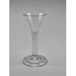 Two 18th century plain stemmed glasses, 12cm and 14cm high. (2)