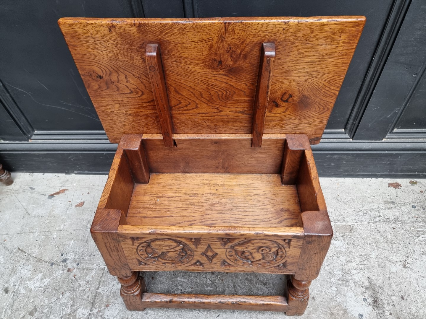 A 17th century style carved oak box seat joint stool, the frieze decorated with two Romayne heads, - Image 4 of 4