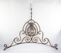 A wrought iron gate overthrow