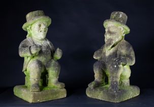 A pair of carved limestone gentlemen