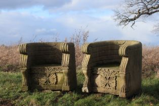 † A pair of carved sandstone throne chairs