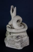 A stoneware serpent fountain