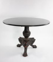 A cast iron circular table with Belgium fossil marble top