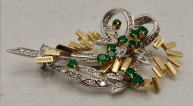 An 18 carat yellow and white gold emerald and diamond spray brooch, late 20th Century