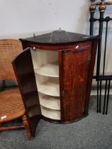 Georgian Bow fronted Mahogany corner wall unit plus rush seated Bergère rocking chair