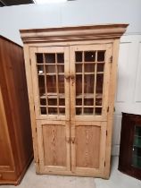 Antique Pine display cupboard with glazed top doors over cupboard