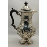 A late Victorian silver hot water jug