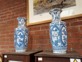 A pair of reproduction blue and white vases