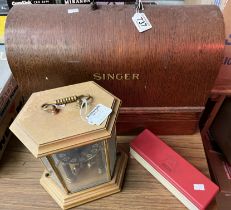 A Singer sewing machine and a mantel clock