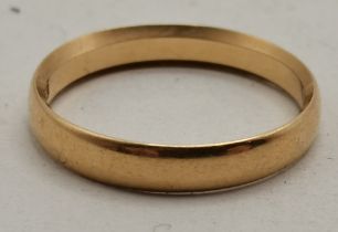 An 18 carat gold band ring