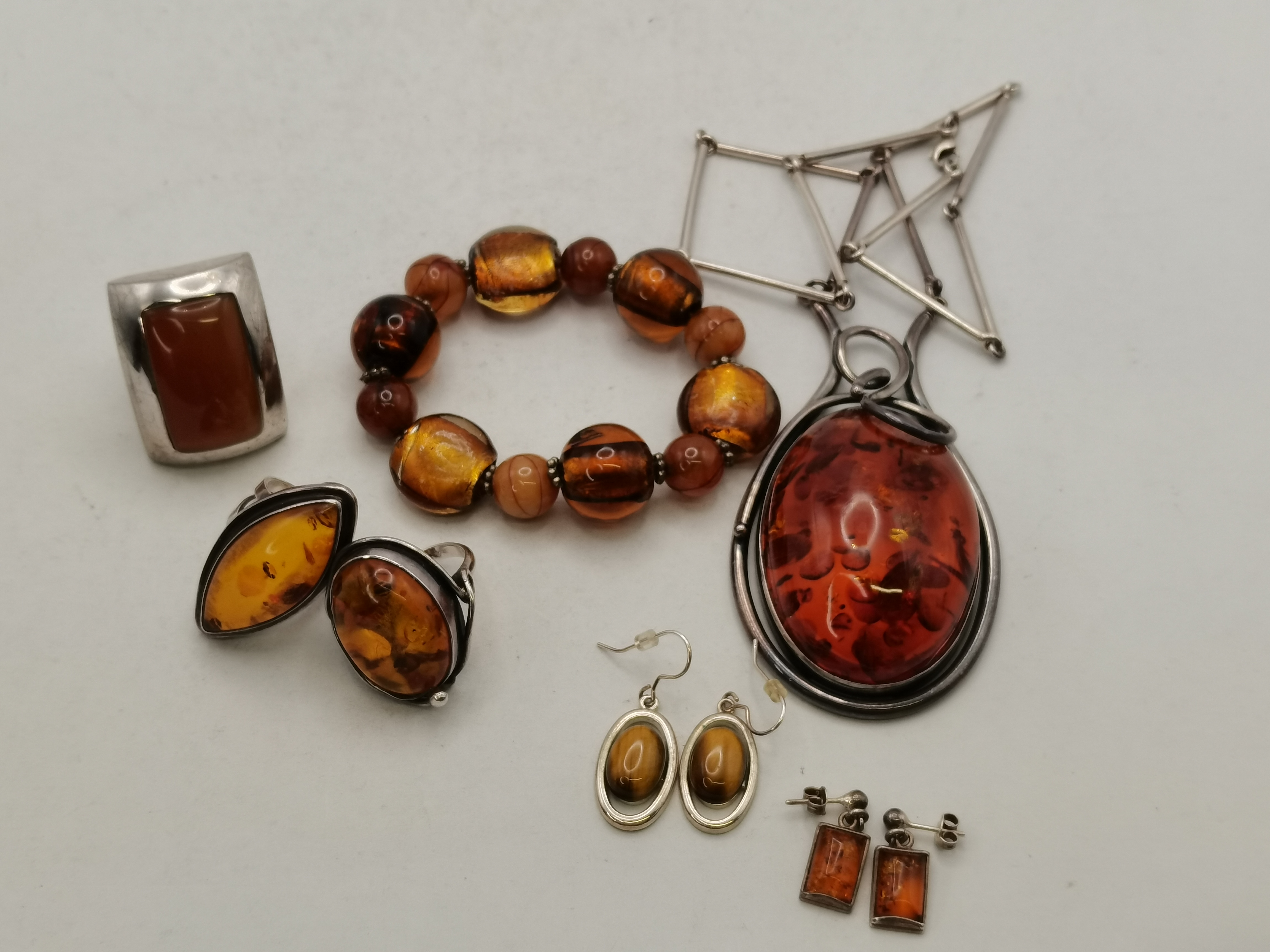 A collection of silver and amber jewellery, etc.