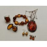A collection of silver and amber jewellery, etc.