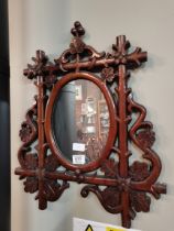 A hardwood carved mirror