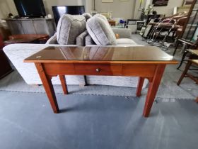 A pair of console tables with single drawer
