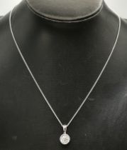 An 18 carat white gold solitaire pendant necklace
