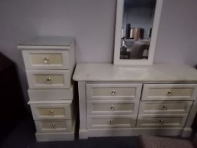 A cream 3 piece bedroom set with matching mirror