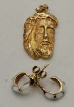 A 14 carat gold figural pendant, and a pair of 14 carat gold and enamel half-hoop earrings