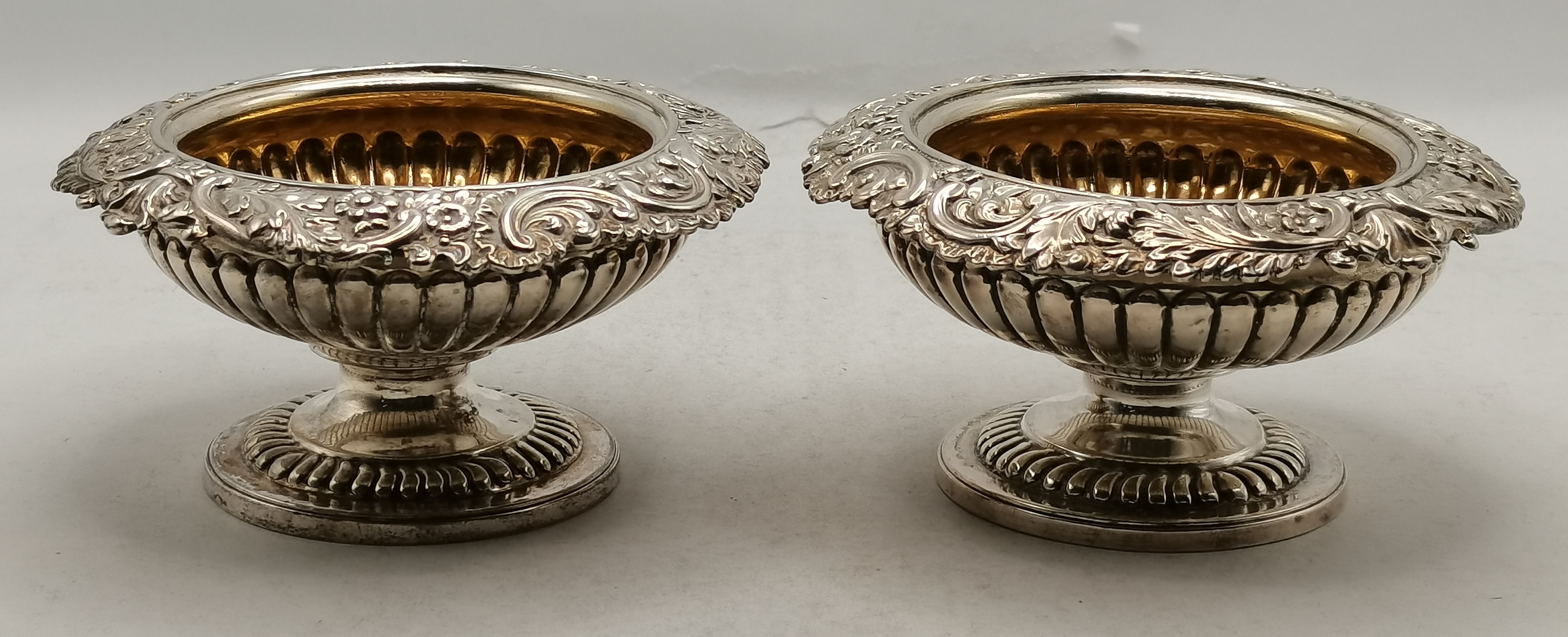 A pair of George III silver pedestal salts