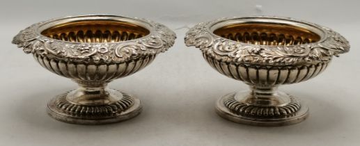 A pair of George III silver pedestal salts