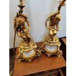 A good pair of gilt and onyx table lamps with cherub decoration 40cm