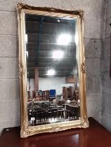 Gilt surrounded wall mirror 130cm x 71cm