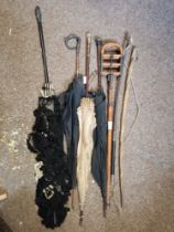 A collection of Victorian parasols, sticks, etc.