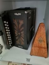 A button accordion, and a metronome