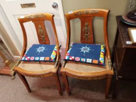 A magnificent pair of fruitwood and brass decoration hall chairs