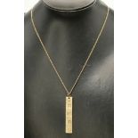 A 9 carat gold ingot pendant necklace on chain