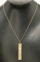 A 9 carat gold ingot pendant necklace on chain