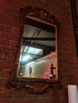 A George III walnut and gilt fretwork mirror