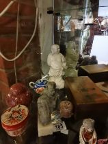 8 pieces of assorted Oriental items - Buddha, carved lions etc
