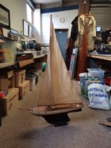 A wooden model pond yacht