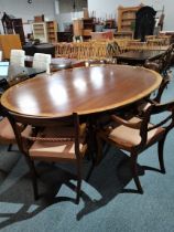 Large Oval Inlaid Mahogany dining table with 6 plus 2 Carver Mahogany Sabre Leg Elbow Chairs