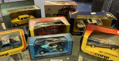 A collection of seven die-cast model vehicles, with boxes