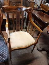 An Edwardian inlaid armchair