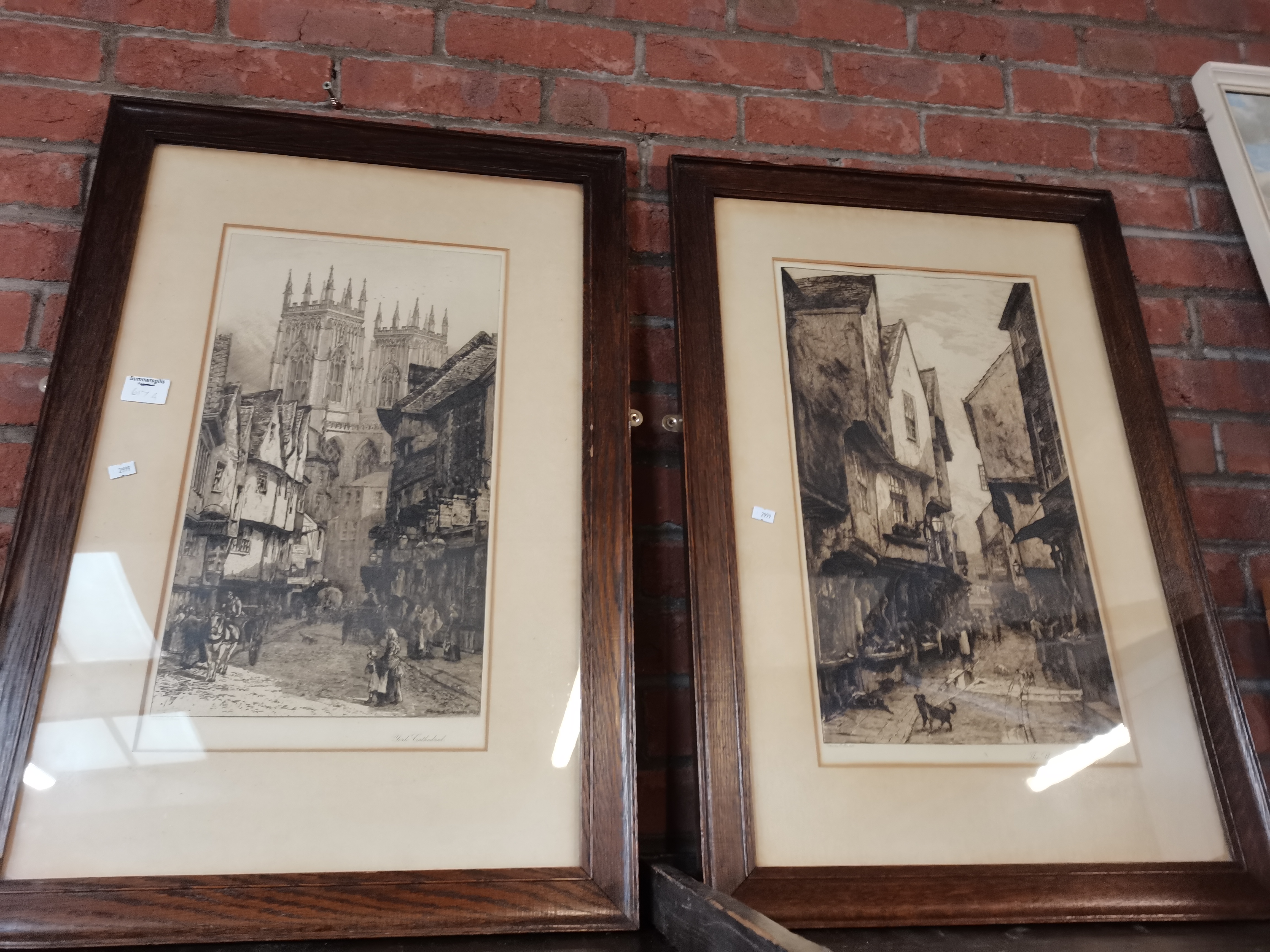 York Interest: A pair of etchings of York street scenes, framed