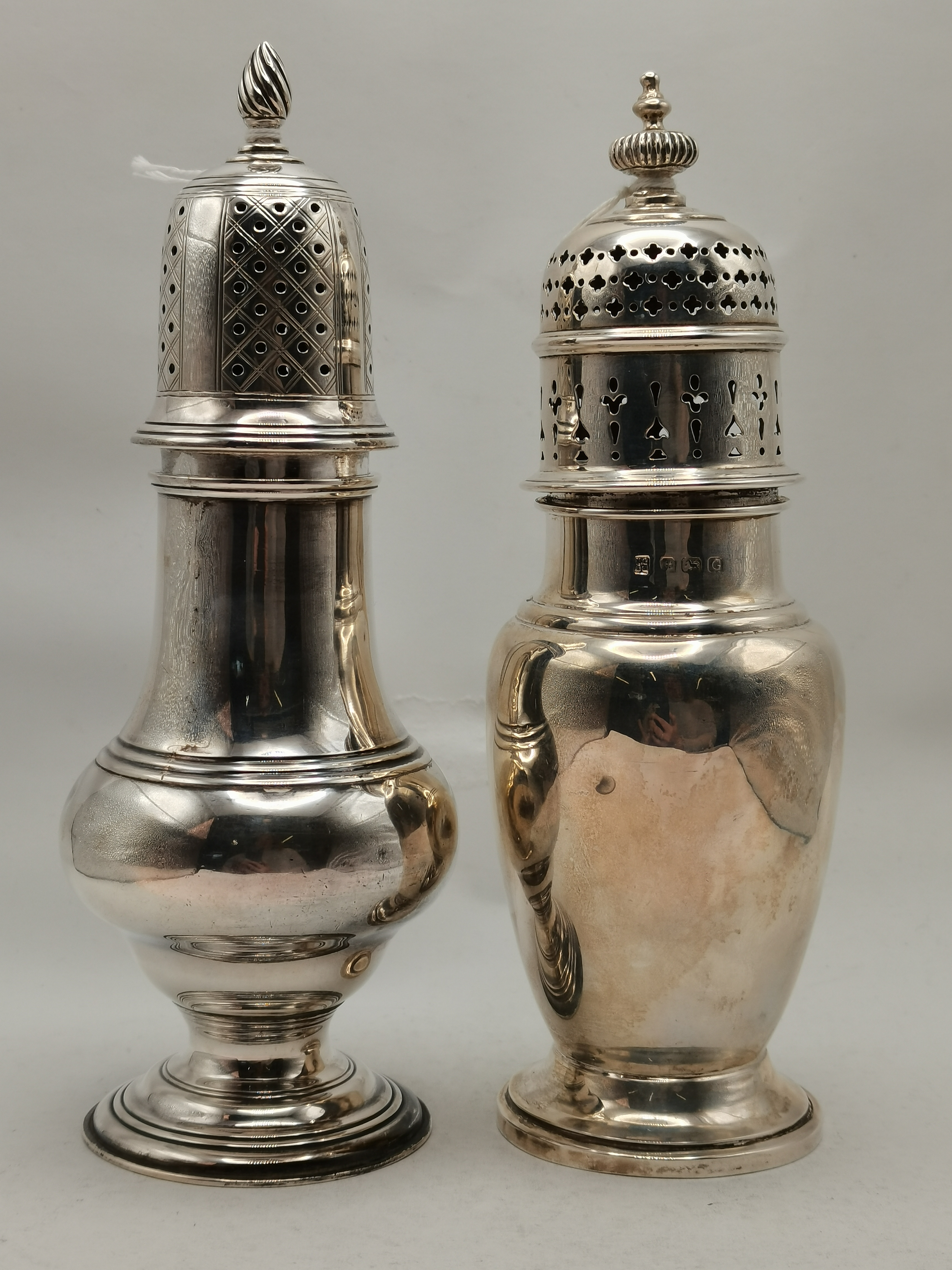 Two silver sugar casters, Victorian and later